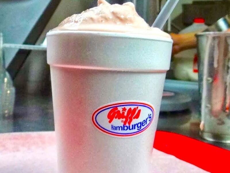 A Griff's ice cream shake in a Griff's cup next to the shake mixer